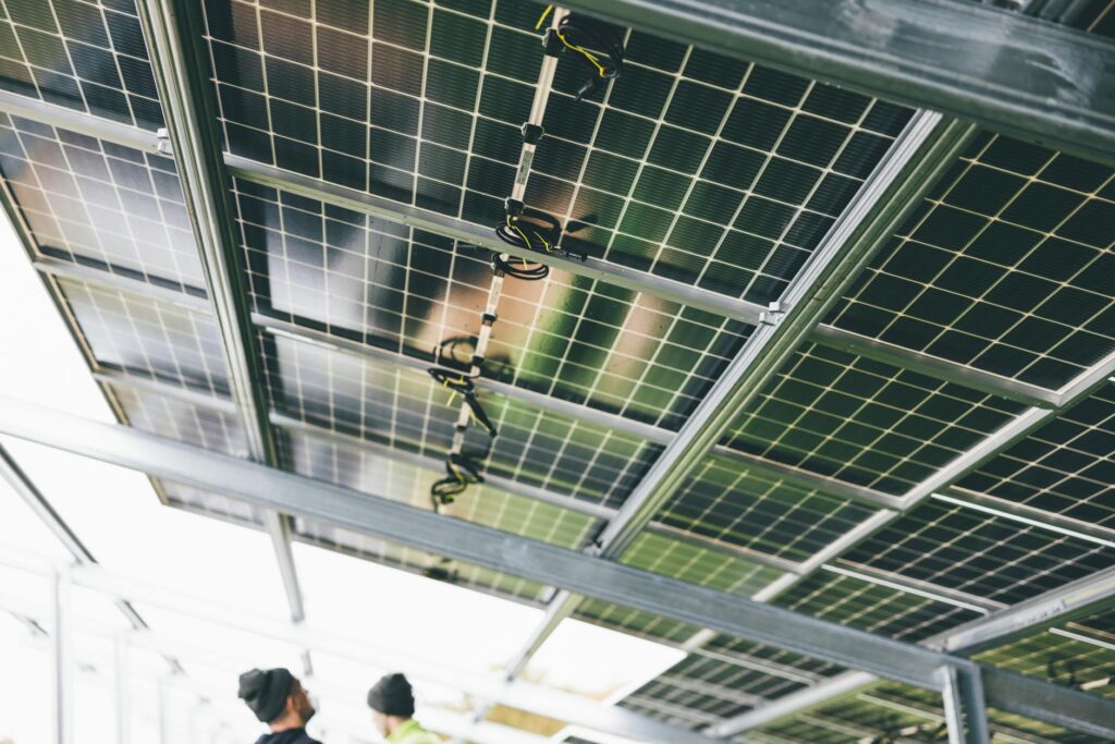 Professional solar panel installer on a rooftop in the USA
