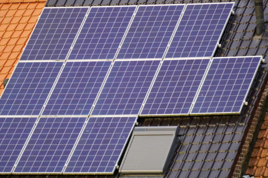 Professional solar panel installer on a rooftop in the USA
