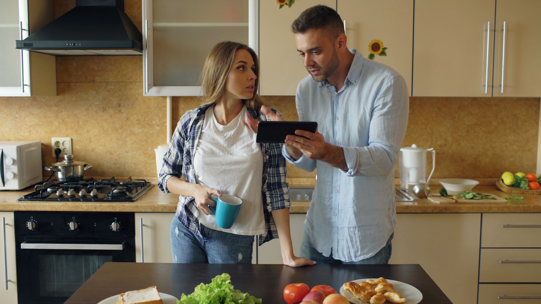 homeowner reviewing plumbers quote on phone UK 2026