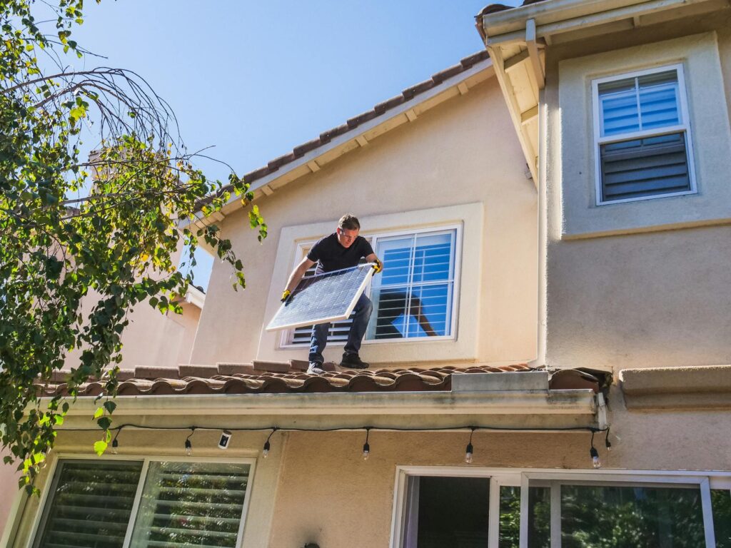 solar installer presenting quote on tablet to homeowner
