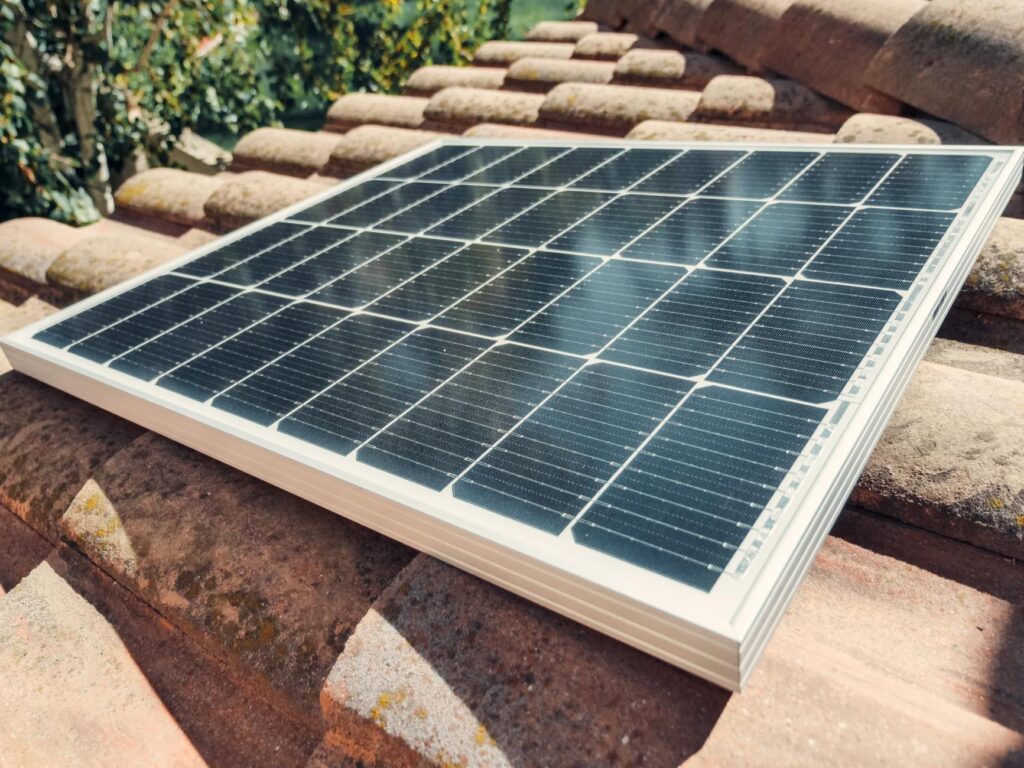 Professional solar panel installer on a rooftop in the USA