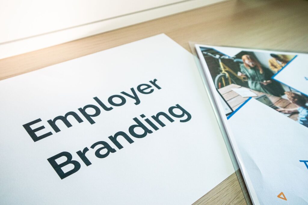 UK employer and new employee reviewing employment documentation at a desk