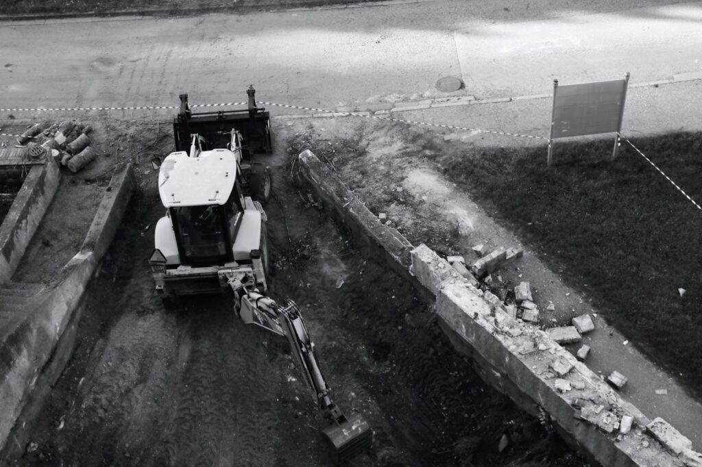 Groundworker operating excavation equipment on a utility infrastructure project in the USA
