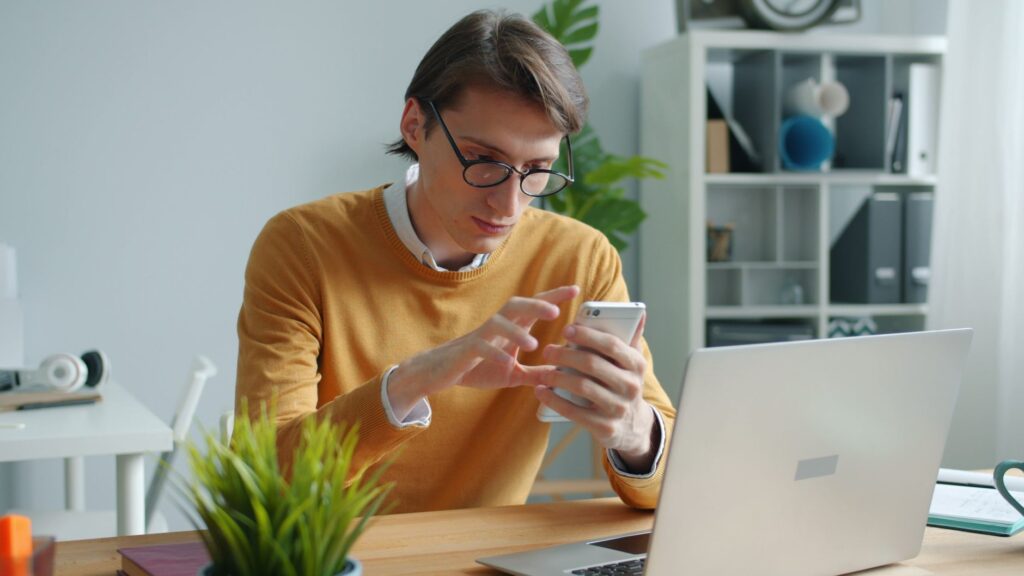 UK tradesperson composing a professional payment chaser email on a phone