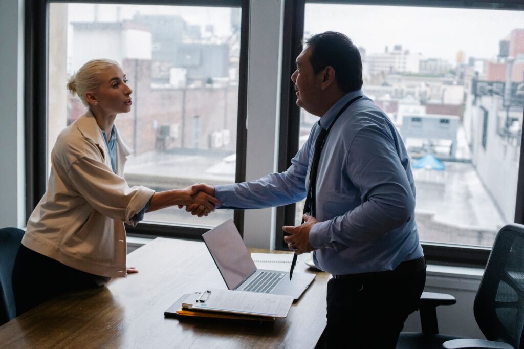 US contractor interviewing a tradesperson candidate in an office setting