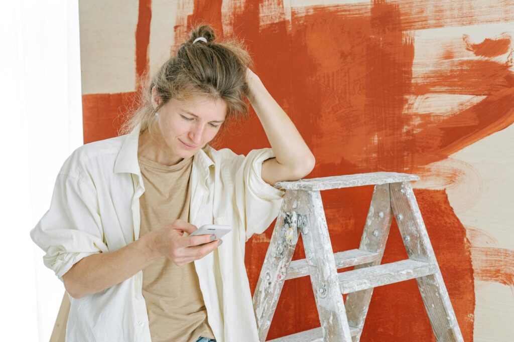 homeowner reviewing painting contractors quote on phone USA 2026
