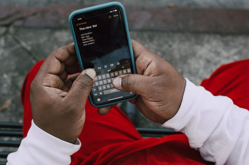 Contractor's phone screen showing a customer list with job history and outstanding quotes