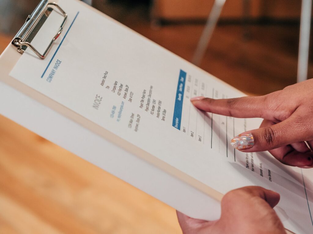 Contractor making a professional follow-up call about an overdue invoice from a job site