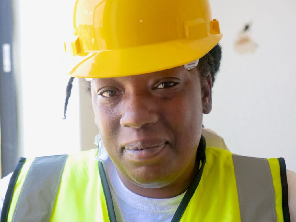 Licensed handyman on a professional job site with credentials visible, USA