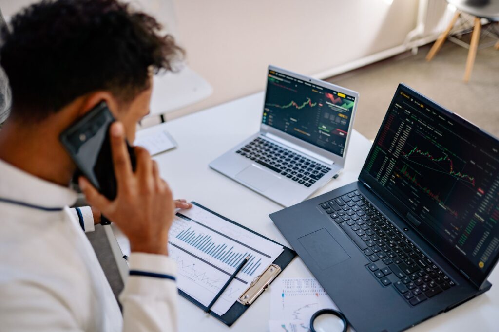 A simple phone-based business management setup versus a complex job management system, contrasting complexity and cost